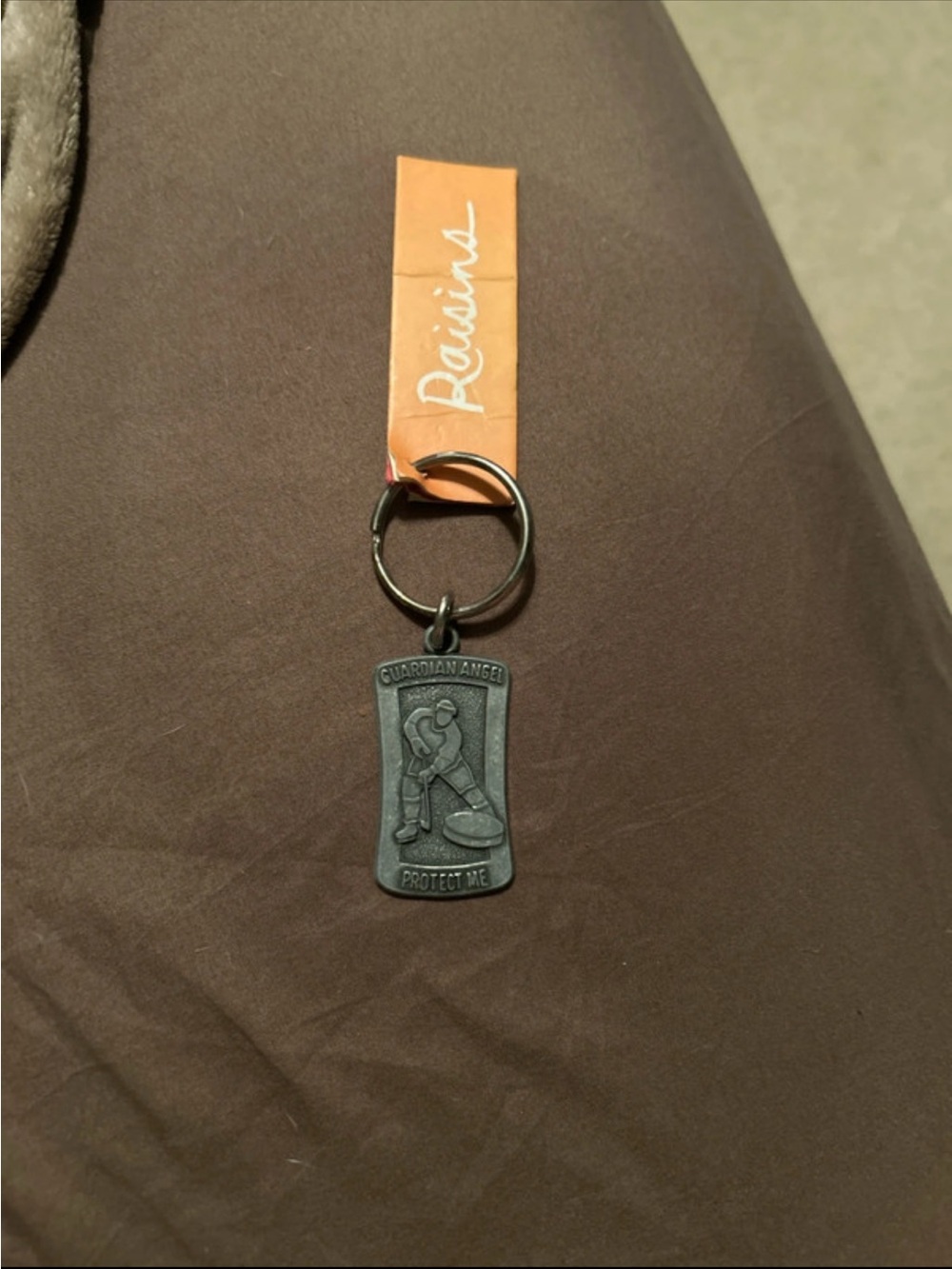 Raisins Guardian Angel Keychain - Black